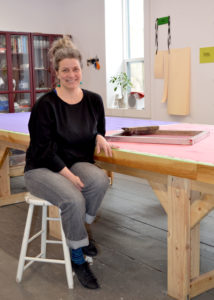 photo of Leslie Menagh in an art studio