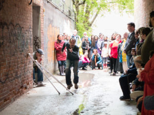 Wes Ryan performing in an alley