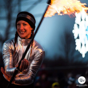 photo of Jennifer Elchuk performing firespinning in winter clothes