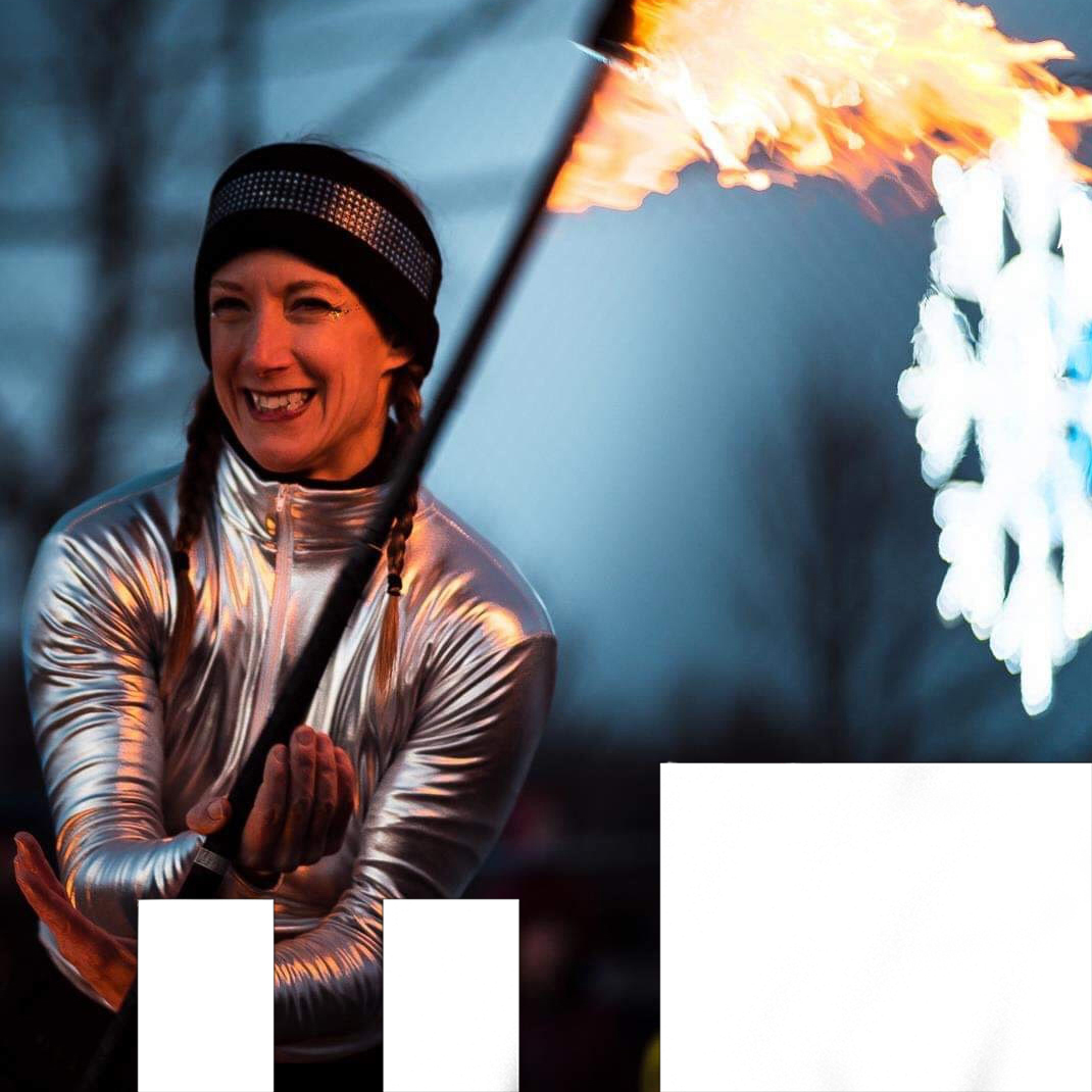 photo of Jennifer Elchuk performing firespinning in winter clothes
