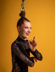 Nicole Malbeuf performing hair suspension