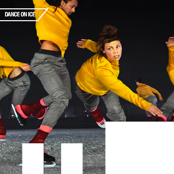 five skaters in matching yellow sweatshirts, grey pants and red and black legwarmers move on the ice, each in a different direction.