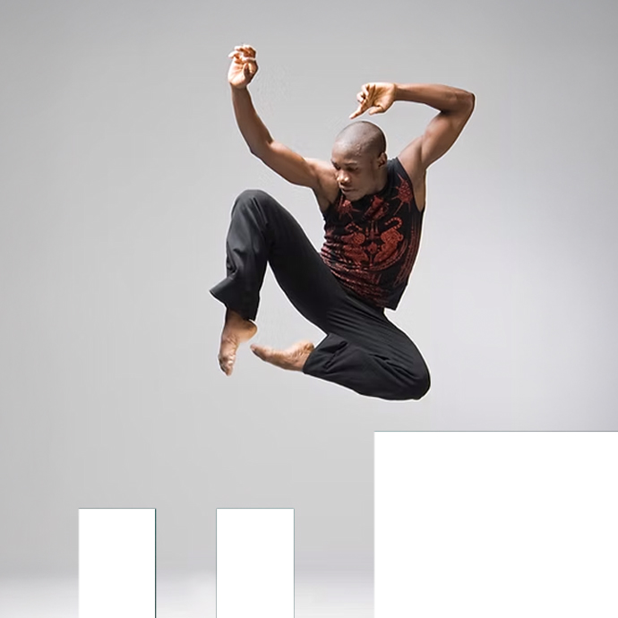 YEBO: Pulga Muchochoma Dancer Pulga Muchochoma leaps into the air, arms above his head, feet pointed in the photo.